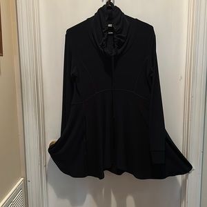 Black long sleeve tunic with a flare bottom and ruffle neck.